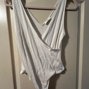 White one-piece ribbed bodysuit from Aritzia